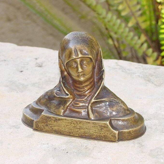 A Small Bronze Of A Woman